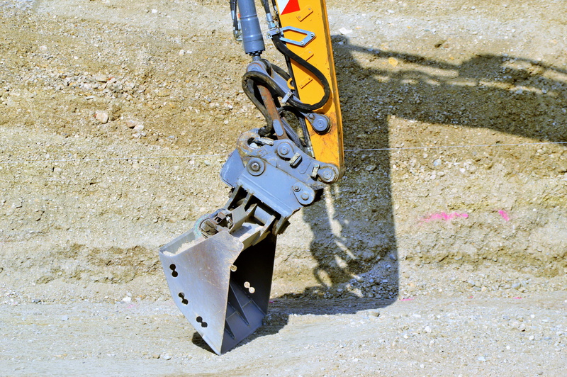 day, chain, outdoors, wall - building feature, black color, silver colored, metal, hanging, site, machine, sunlight, close-up, construction machine, construction site
