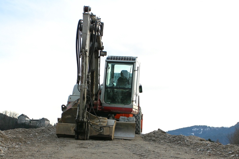 nature, mode of transportation, day, earth mover, backhoe bucket, construction industry, sky, development, men, quarry, construction site, work machine