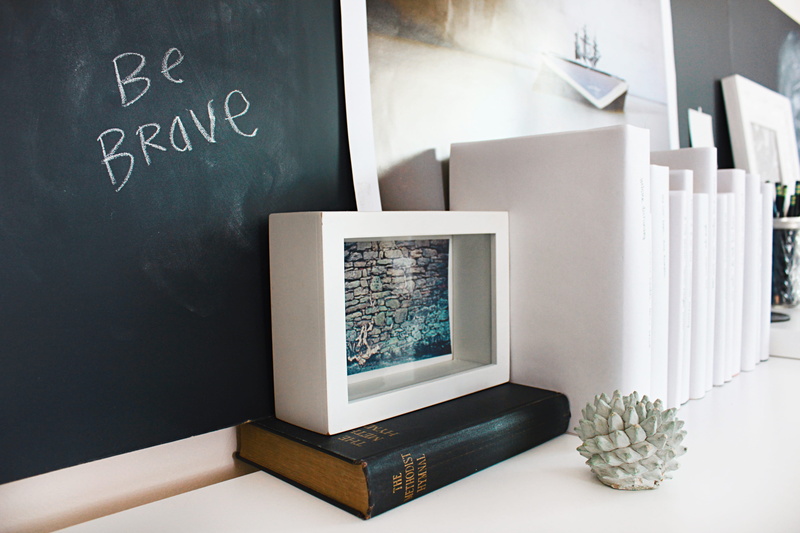 book, sunlight, wall, blackboard, interior design, western script, communication, board, handwriting, near, bravery, office decor, indoors, white, home interior