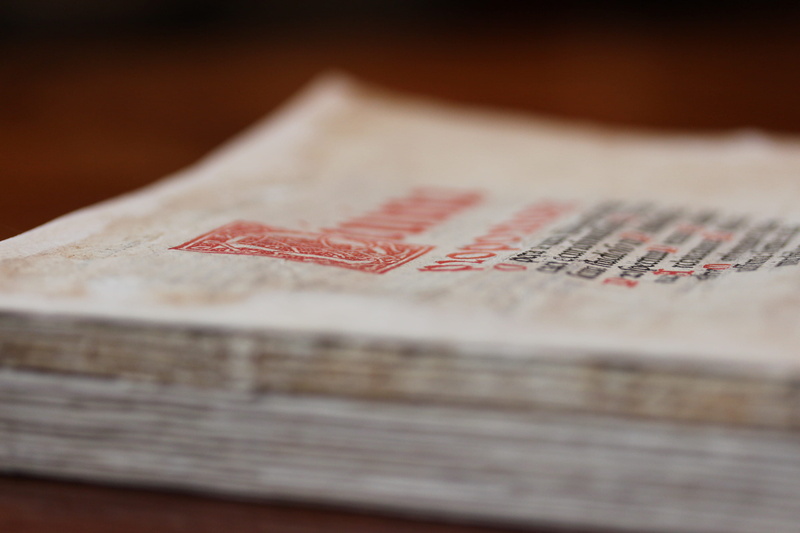 flyer, text, food, clothing, table, stack, paper, the past, arts culture and entertainment, close-up, first aid, indoors, furniture, wood - material, selective focus