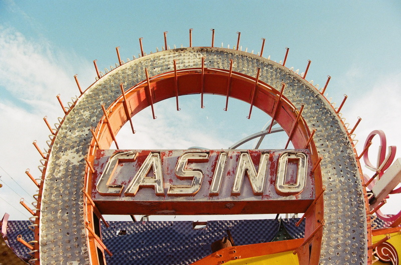 gate, metal, amusement park, architecture, text, outdoors, capital letter, film, casino, vegas, entrance, no people, sky, degraded, arts culture and entertainment