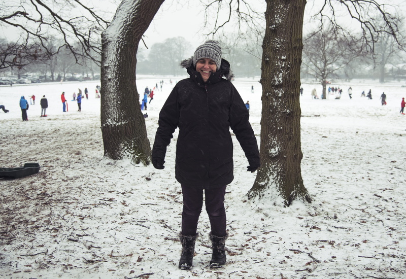 warm clothing, day, clothing, united kingdom, one person, real people, hat, sledging, standing, snow, nature, trunk, outdoors, front view, coat, cold temperature