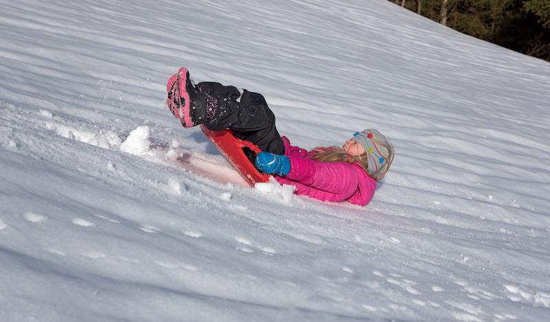 Girl, outdoors, cold temperature, backwards, Child, out, warm clothing, speed, real people, in motion, full length, in action, lying down, down, slide