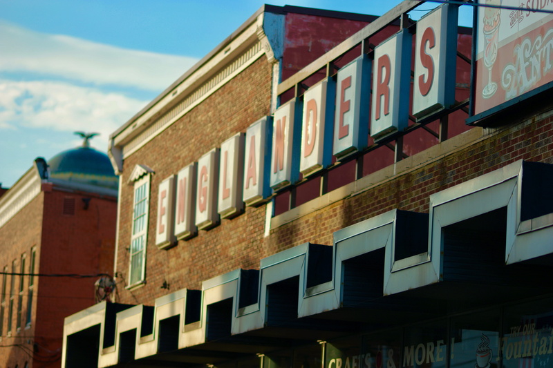side by side, in a row, cloud - sky, sky, building, no people, oakland, soda fountain, diner, united states, town, window, communication, maryland, drug store