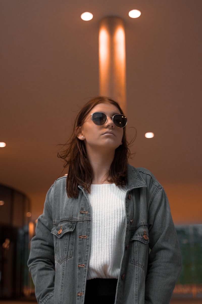 electric lamp, wien, waist up, austria, fashion, orange, casual clothing, front view, illuminated, light, indoors, portrait, young adult, lifestyles, adult