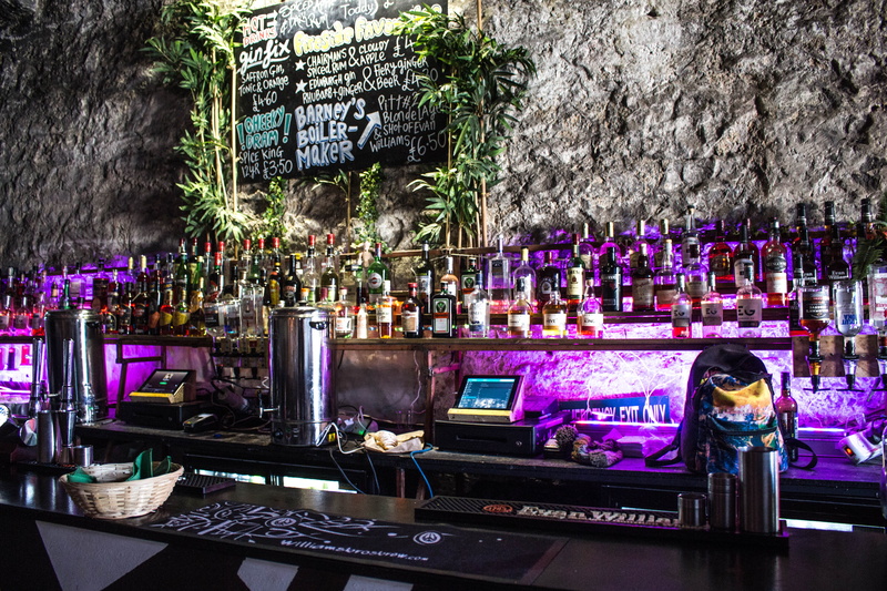 day, flower, outdoors, large group of objects, pub, for sale, nature, sign, communication, business, led, bar counter, retail, party, fireside, scotland