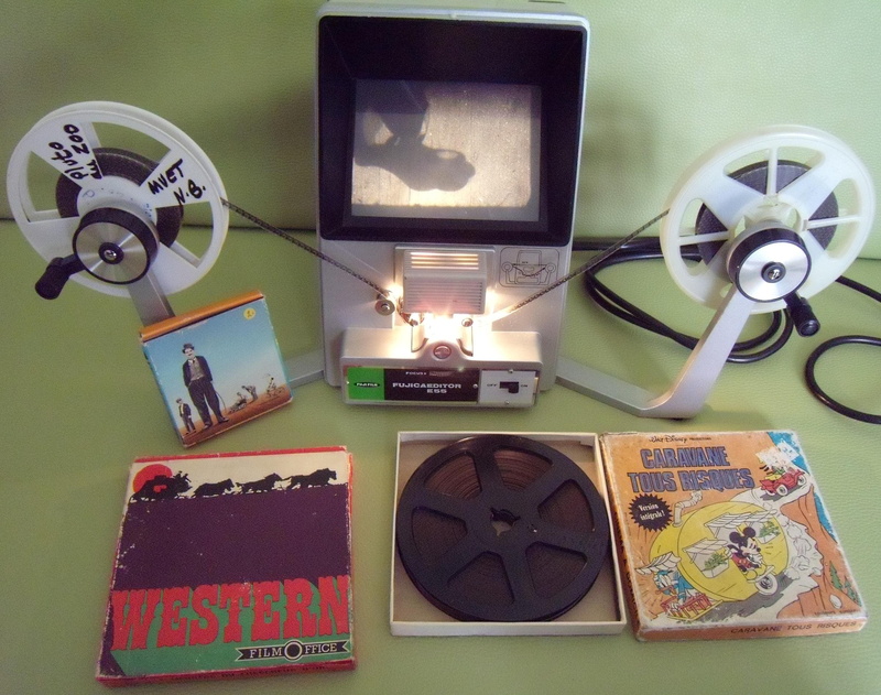 male likeness, representation, film reel, Film, human representation, electric lamp, creativity, photography themes, movie, directly above, candle, indoors