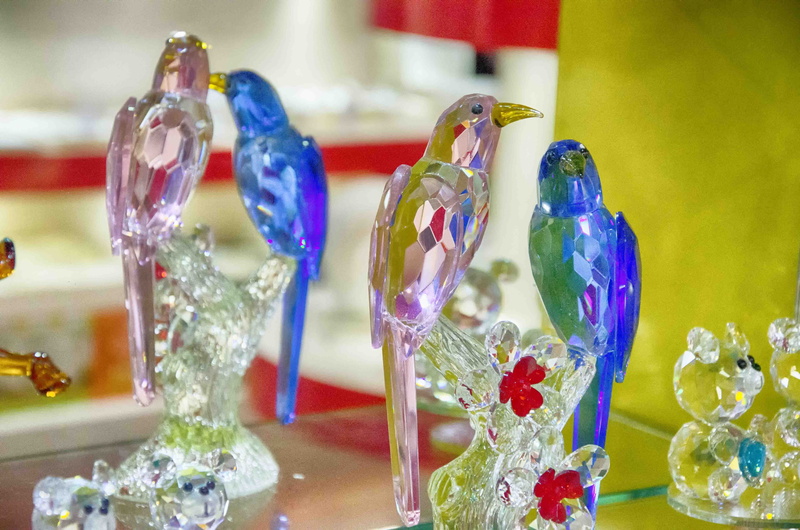 multi colored, style, yellow, art and craft, glass, event, choice, food and drink, animal, blue, crystals, large group of objects, bird, banquet, swarovski
