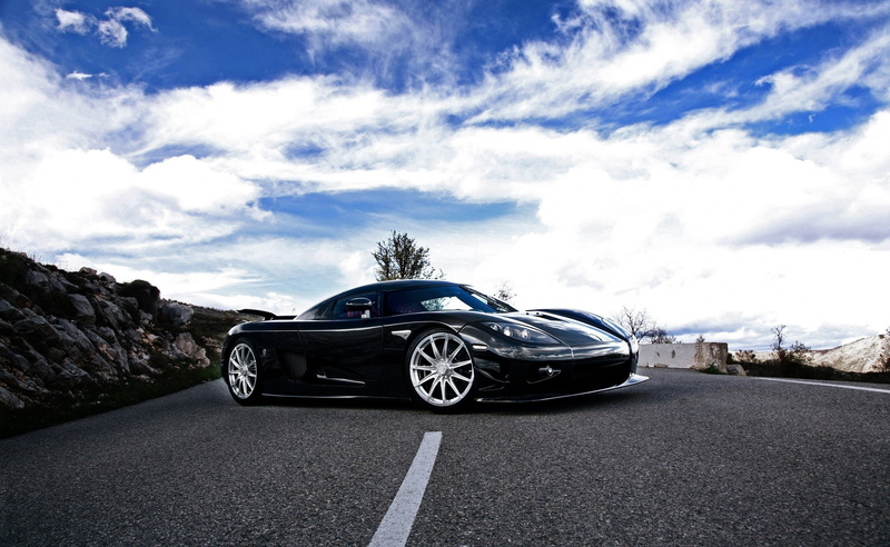 sign, street, road, land vehicle, CCXR, sky, stationary, day, black, Cars, transportation, nature, coupe, cloud - sky, car, no people, motor vehicle, Koenigsegg