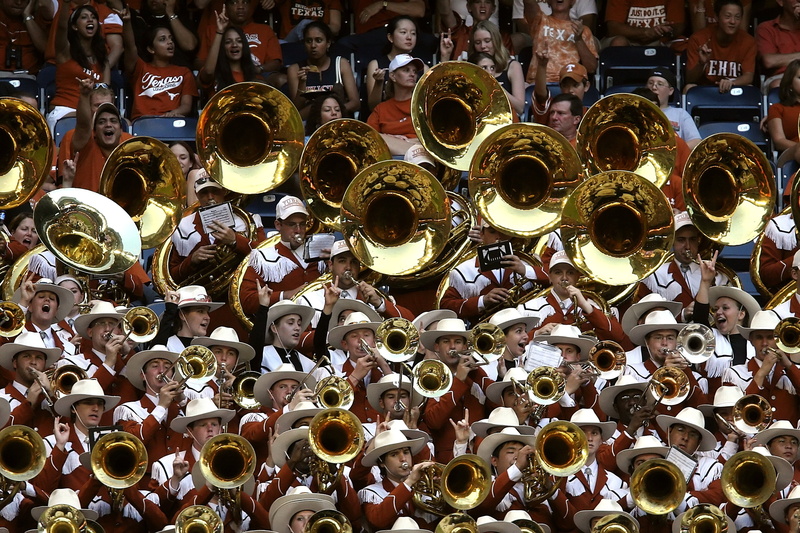 large group of objects, golden, people, sound, clothing, day, parade, performing, performance, festive, enthusiasm, college football game, brass band, togetherness