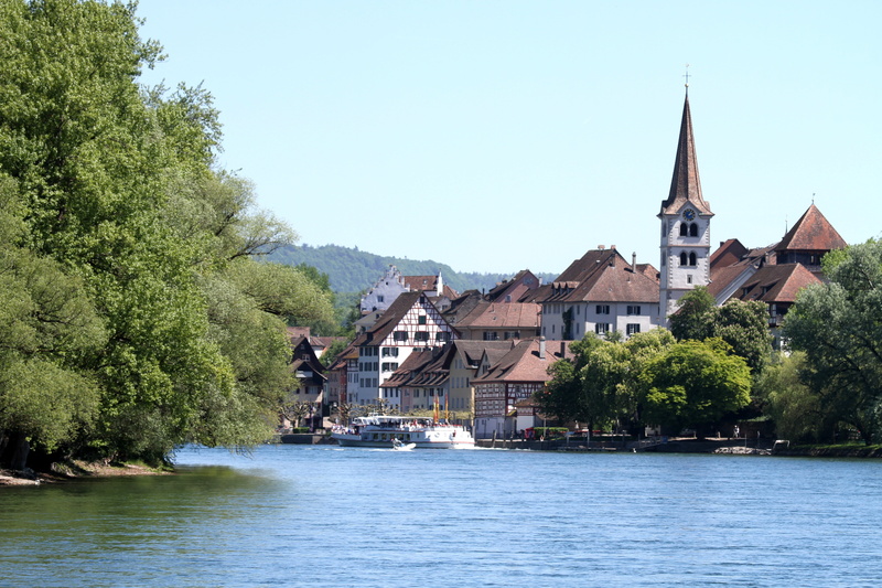 built structure, sky, spirituality, building exterior, stein am rhein, shipping, place of worship, spire, river, waterfront, channel, belief, tree, village