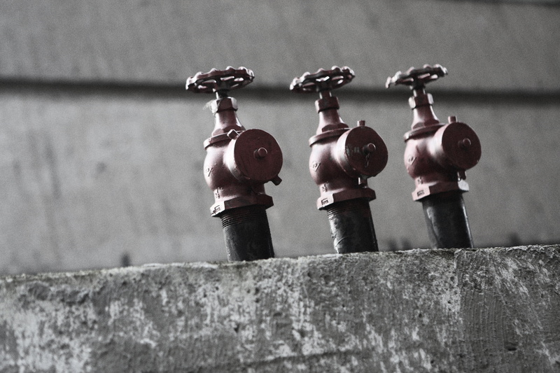security, close-up, concrete, fire hydrant, industrial, safety, outdoors, weathered, equipment, protection, three, no people, gate, side by side, control