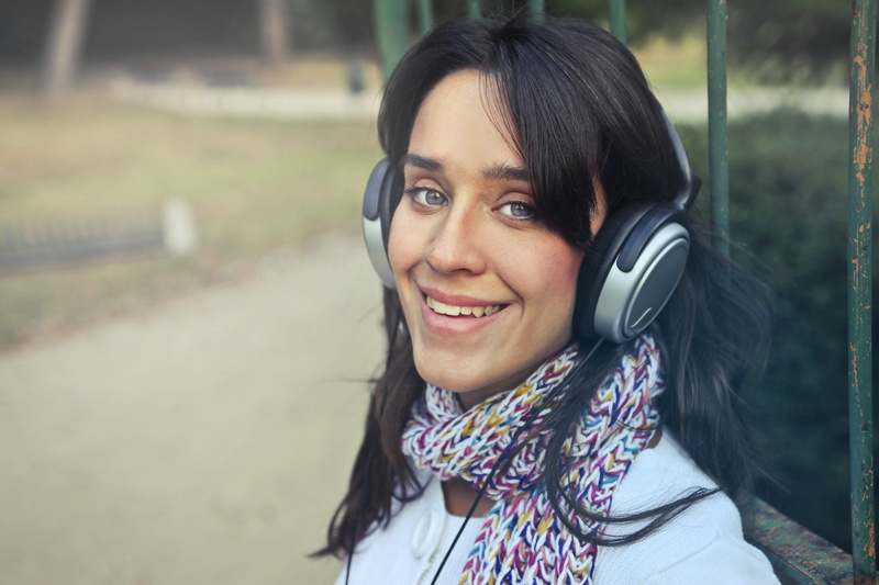 women, people, one woman only, looking at camera, emotion, smile, headphone, eye contact, leisure activity, earphone, smiling, outdoors, one person, autumn