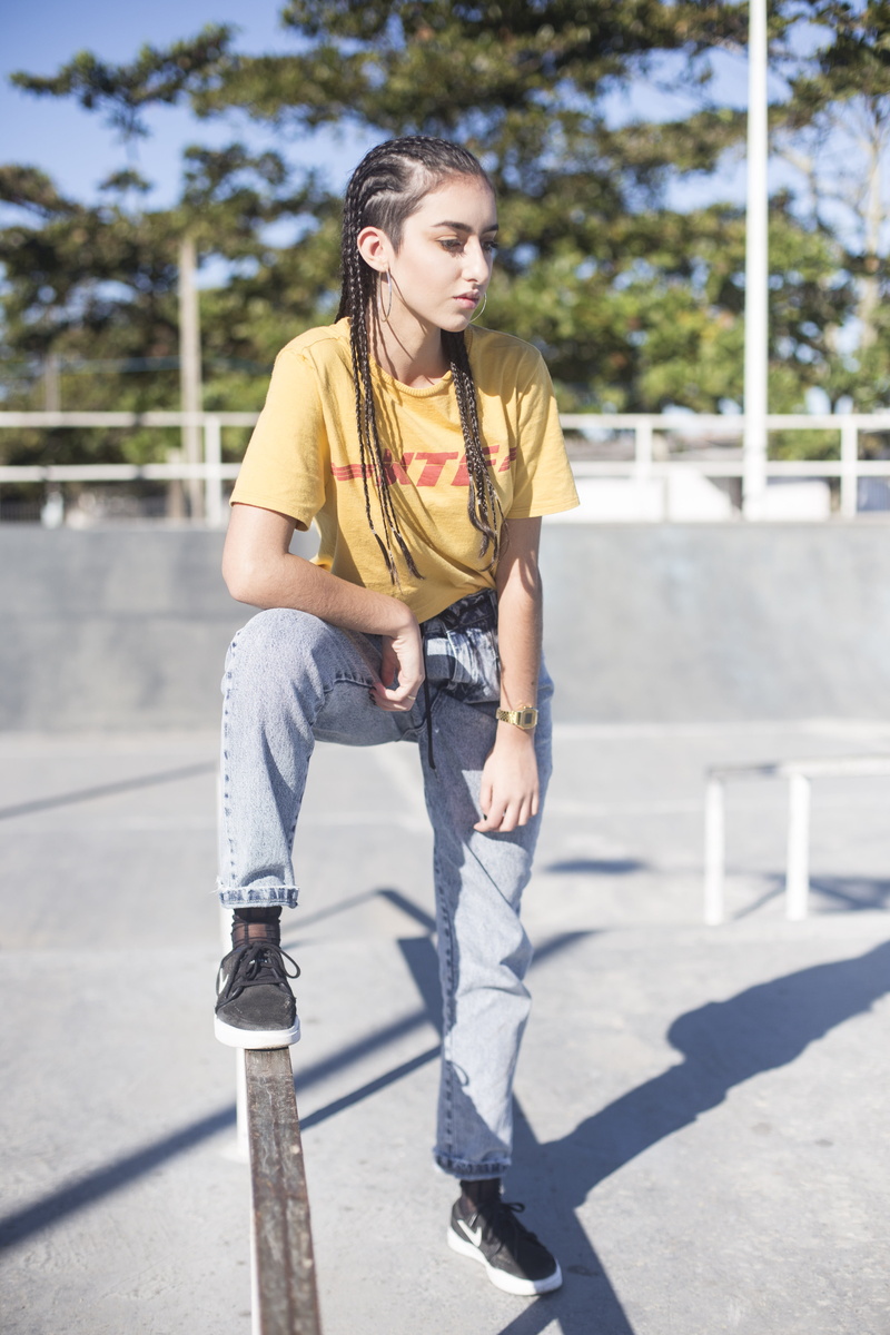 trees, looking, hair, person, girls, shadow, pretty, teenager, daylight, fashionable, day, facial expression, sneakers, hairstyle, real people, pants, footwear
