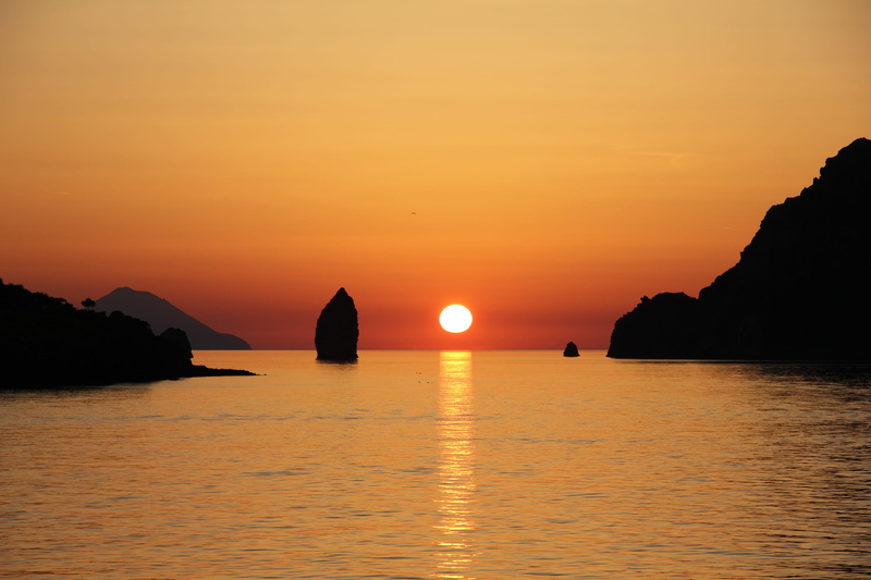water, orange color, sicily, stack rock, outdoors, aeolian islands, sky, beauty in nature, 5K, sunset, no people, tranquil scene, horizon over water, vulcano