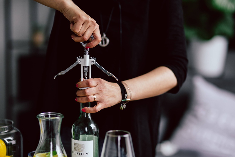 midsection, cork, focus on foreground, female, wine bottle, white wine, human Hand, only men, preparation, woman, holding, nightlife, one Person, indoors