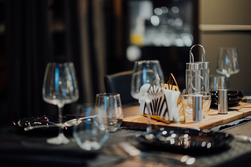 beer, wine glass, goblet, dining table, focus on foreground, close-up, setting, drinking glass, wineglass, food and drink, business, musical instrument