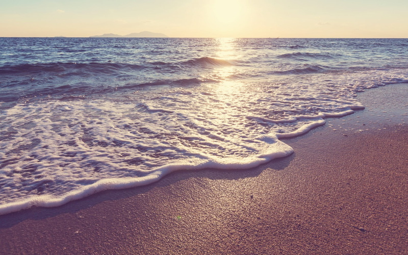 beauty in nature, island, surfing, sea foam, sky, tranquility, coast, nature, scenics - nature, land, sport, beach, sunset, water, sea, horizon, horizon over water