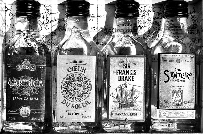 Origin, container, food, food and drink, label, hard liquor, drinking glass, close-up, no people, bottle, Bottles, large group of objects, glass - material