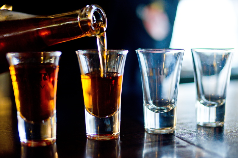 cocktail, alcohol, hard liquor, shot glass, glass, food and drink, group of objects, indoors, food, bar - drink establishment, bar counter, drink, focus on foreground