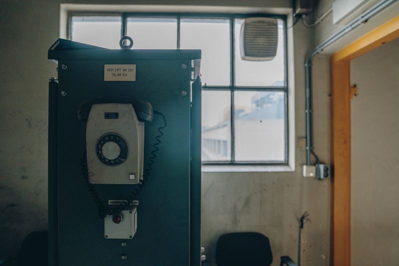 telephone, focus on foreground, blow dryer, 5K, number, entrance, towel, technology, hair drier, phone, indoors, old, close-up, no people, floor, lock