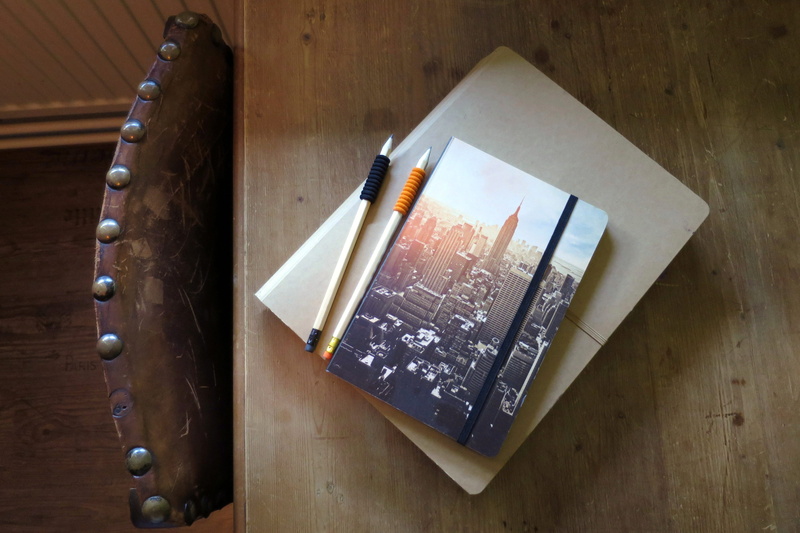 sketch, indoors, high angle view, scripture, no people, table, notebooks, food and drink, notebook, wood - material, state, directly above, note, sketchbook
