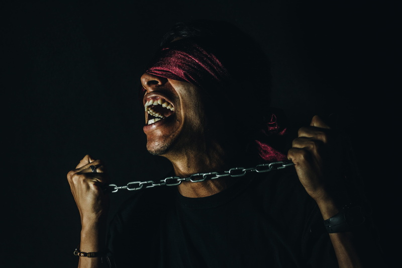 human face, emotion, front view, yelling, neck, clothing, chain, mature adult, libre, 5K, one person, portrait, smiling, adult, studio shot, belief, headshot