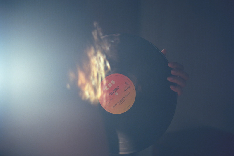 colored background, digital composite, black, lp, person, single object, vinyl, hand, disc, sound, circle, copy space, studio shot, music, retro, human hand