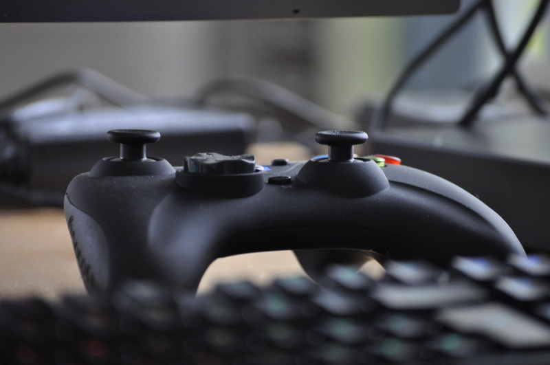 selective focus, computer, electronics, day, metal, controller, no people, virtual, technology, video, play, handgun, close-up, nes, weapon, man made object