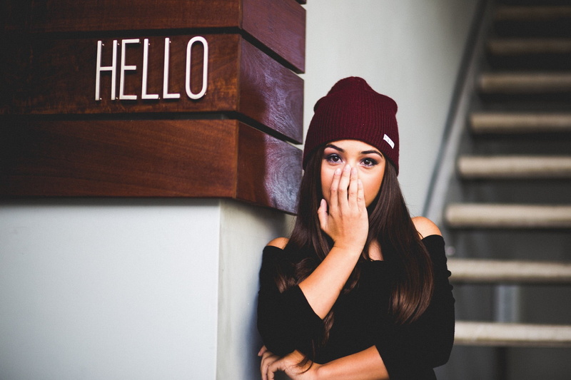 clothing, lifestyles, looking at camera, waiting, Hector Camacho, headshot, young adult, looking, women, hair, adult, indoors, hands covering mouth, one person