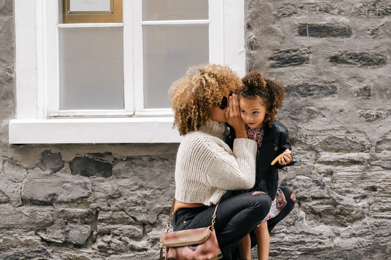 lifestyles, building exterior, day, color Image, adult, leisure activity, sitting, two People, white, mid adult women, whisper, hair, architecture, carrying
