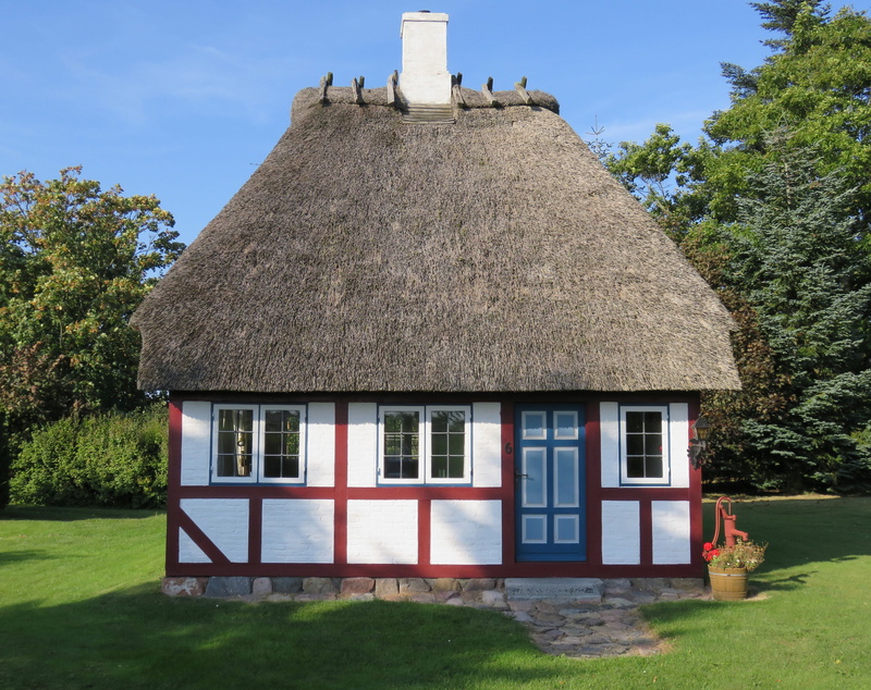 is used as a holiday home, sunlight, field, architecture, Building, with thatched roof, roof, outdoors, Small, built structure, nostalgic, no people, day