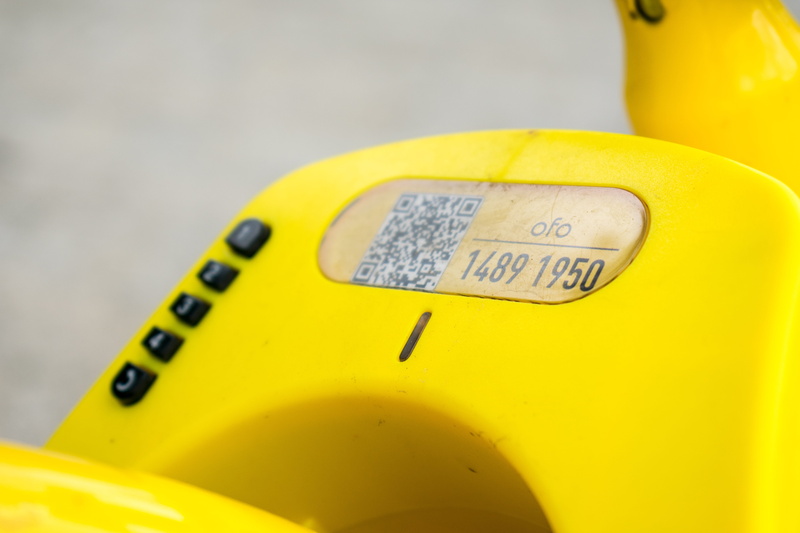 focus on foreground, text, capital letter, transportation, western script, lock, yellow, technology, no people, mode of transportation, bicycle, car, the little yellow car