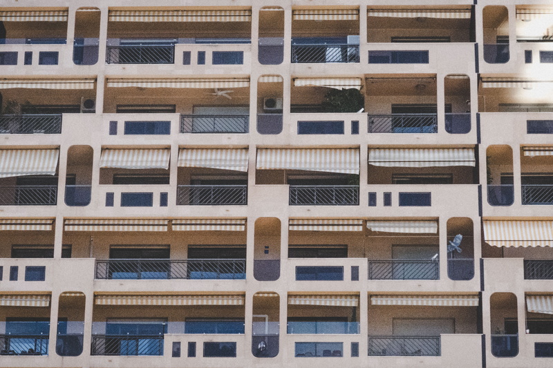  glass - material, taking, outdoors, exterior, hive, pattern, person, urban, day, apartment, urban, in a row, city, view, building