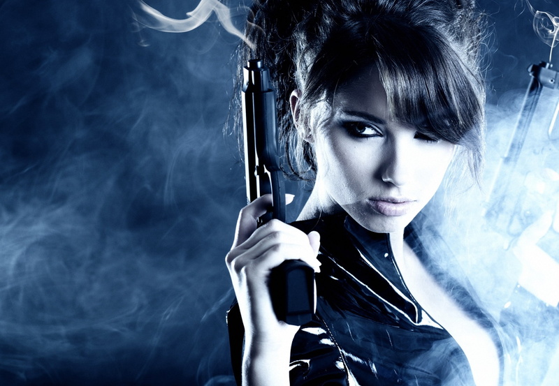 adult, studio shot, looking at camera, one person, gun, indoors, holding, beauty, real people, girls with guns, women, bangs, front view, smoke - physical structure