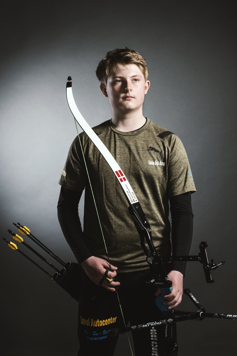 young men, aims, electric guitar, archery, man, one person, young adult, waist up, looking at camera, microphone stand, 8K, performance, shoot, sports