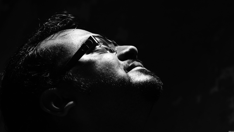 studio shot, facial hair, mid adult, 4K, eyeglasses, face, men, believe, adult, headshot, male, one person, contemplation, close-up, black background