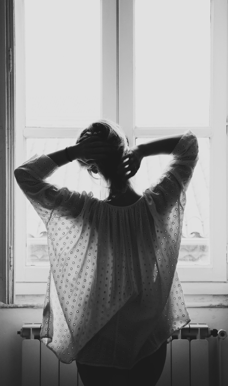 hairstyle, photograph, human hair, pose, woman, front, real people, shadow, day, standing, arms raised, interior, rear view, 2K, waist up, casual clothing