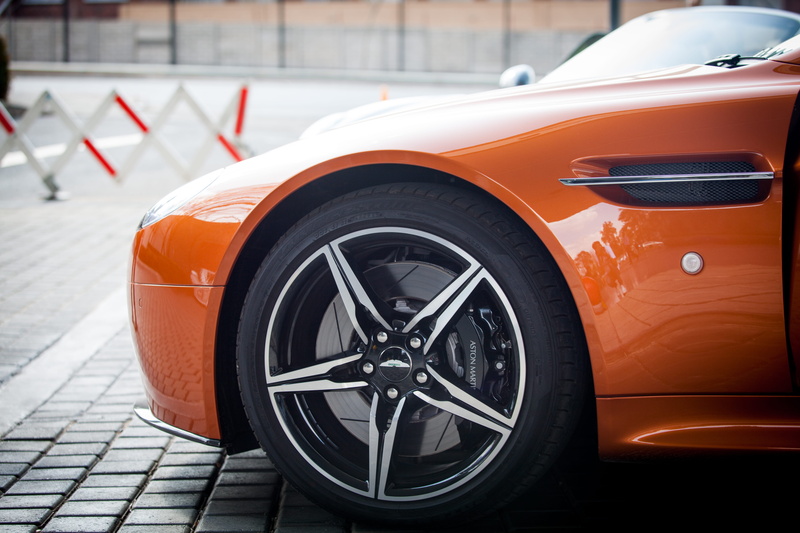 orange, travel, aston martin, mode of transportation, day, parked, pavement, car, stationary, close-up, street, sign, 5K, outdoors, sports car, parking