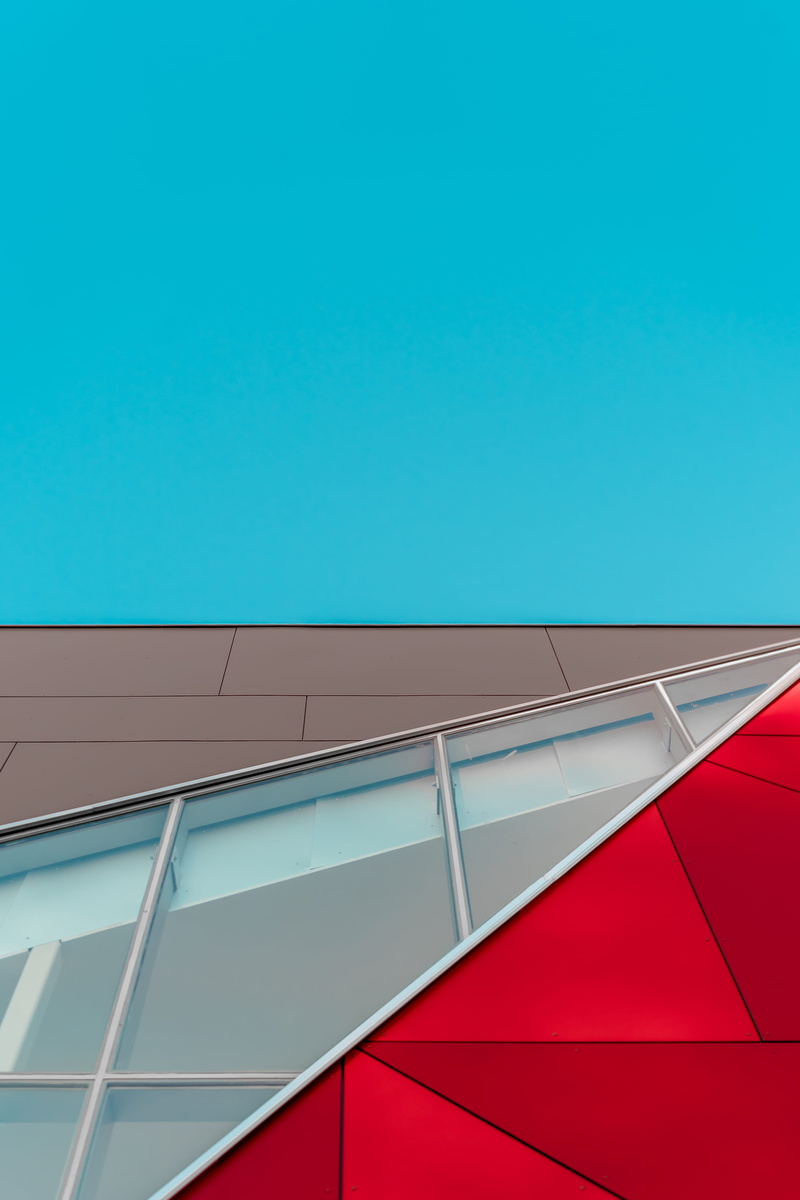 low angle view, brown, white, blue, wiindows, window, panel, day, triangular, backgrounds, pattern, outdoors, sunlight, city, red, clear sky, photography