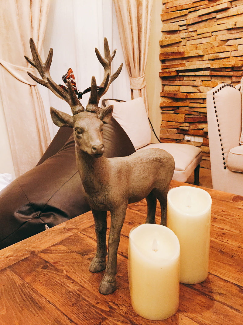 deer, wood - material, animal representation, no people, candle, one animal, home decor, mammal, table, indoors, animal themes, decoration, animal wildlife
