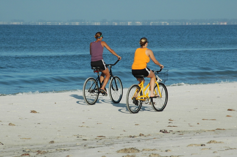 happy, two, bicycles, transportation, action, ride, activity, lifestyles, healthy, motion, biking, water, men, real people, outdoors, girl, leisure, leisure activity