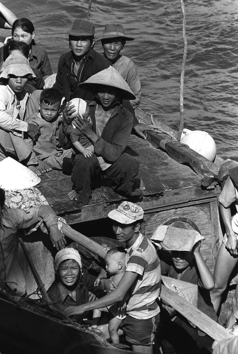 victims, headwear, baby, boat people, 1982, nautical vessel, high angle view, sitting, day, fisherman, rescue, distress, people, viet nam, eight days in sea