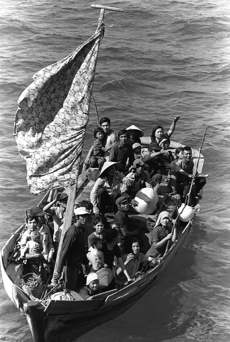 men, mode of transportation, rescue, group of people, relief, oar, nautical vessel, flag, baby, uss blue ridge, children, real people, fishing vessel, rowboat