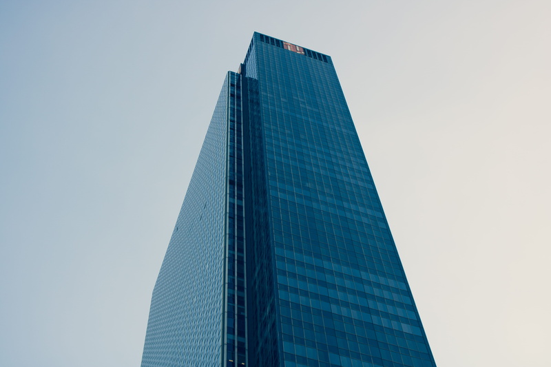 building, clear sky, glass - material, reflection, low angle shot, skyscraper, windows, perspective, steel, architecture, high-rises, downtown, office building exterior