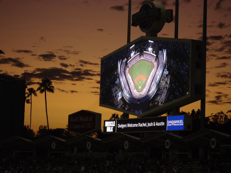 jumbotron, arts culture and entertainment, tree, sign, sky, text, screengrab, dodgers, plant, building exterior, night, outdoors, stadium, baseball, nature