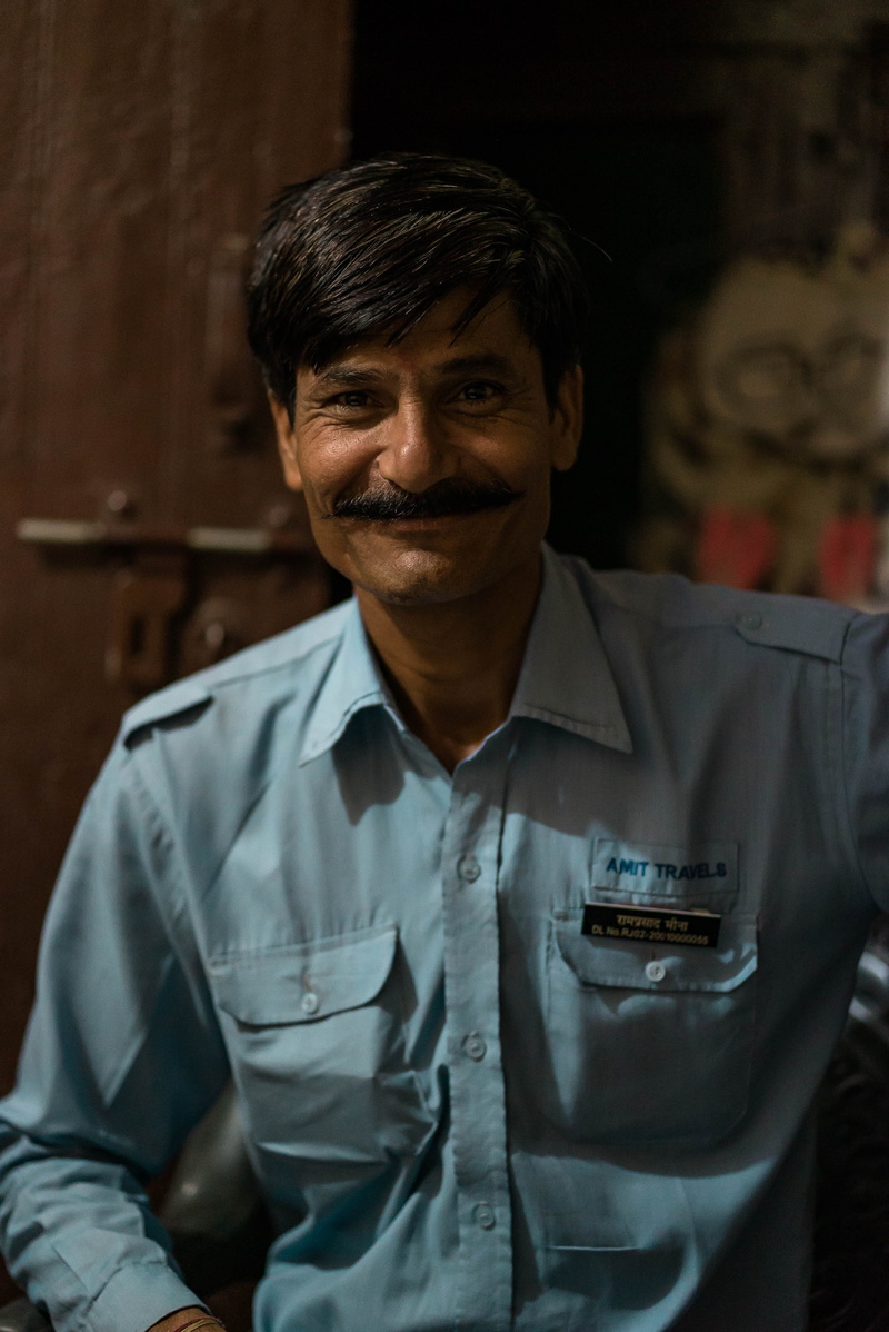 shirt, blue, looking at camera, focus on foreground, men, india, mature adult, military, one person, males, driver, real people, tan, man, officer, shadows