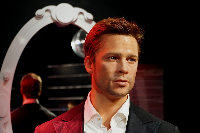 framed, near, looking at camera, Brad Pitt, wearing, lifestyles, young men, headshot, role, film, occupation, wax figure, Face, hairstyle, peak, man, lapel