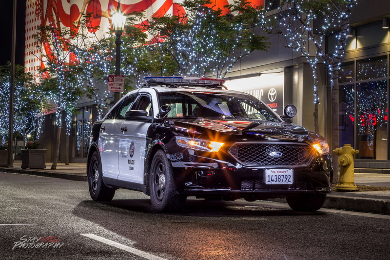 road, tree, car, night, stationary, transportation, mode of transportation, building exterior, street, city, nature, land vehicle, police, illuminated