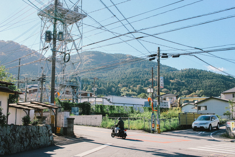 person, fuel and power generation, wheel, architecture, 5K, riding, power line, human, asphalt, no people, electricity, street, built structure, fukuoka